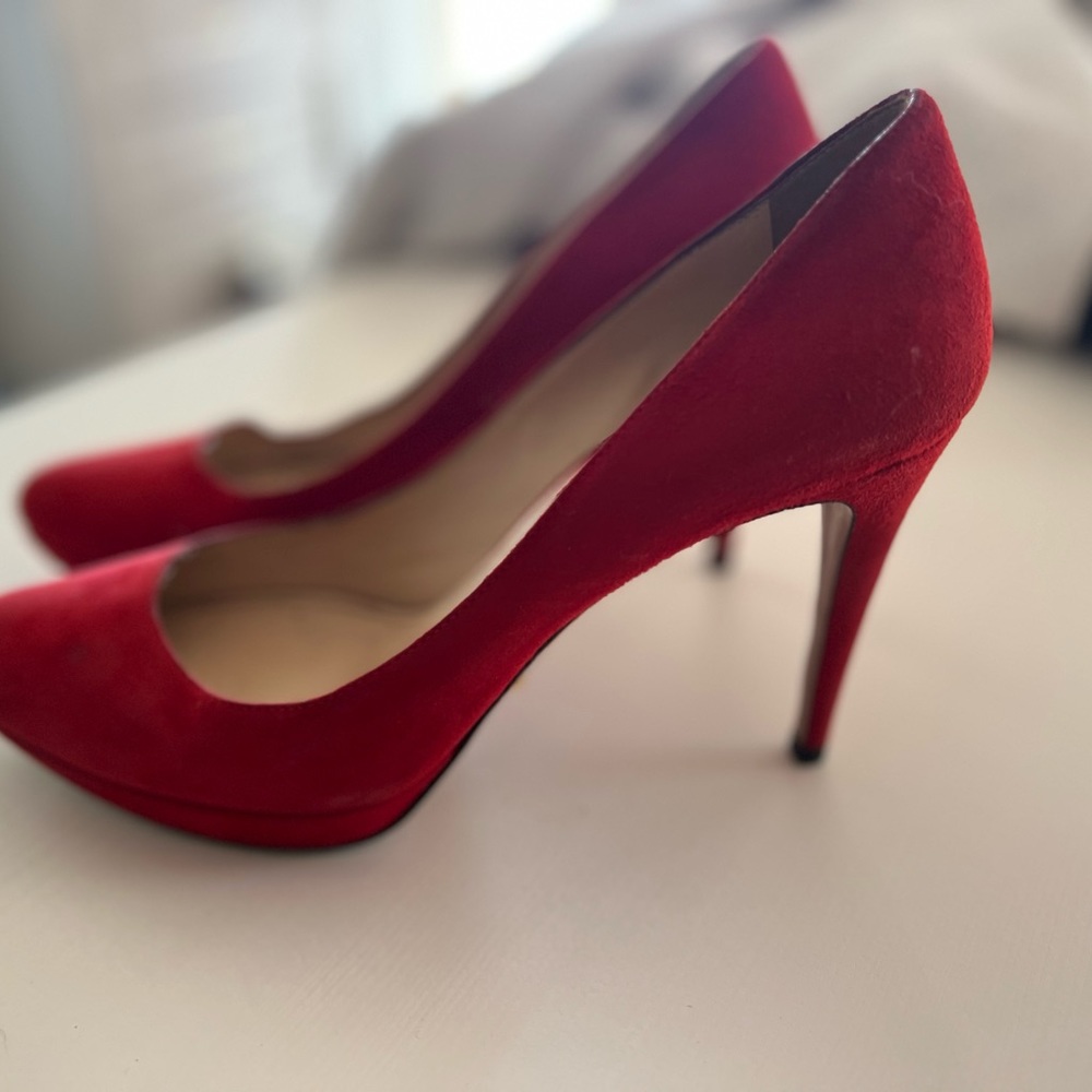 Red suede Prada heels. 38.5